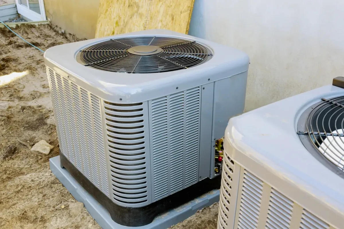Two outdoor air conditioner condensers